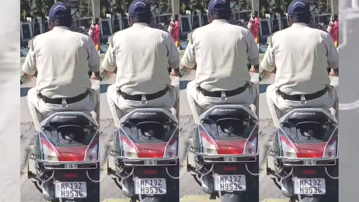 पुलिसकर्मी का बगैर हेलमेट वाहन चलाने का फोटो पोस्ट करने की मिली 'सजा', काट दिया चालान