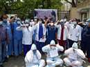 Nurses Association made a symbolic display wearing PPE kit